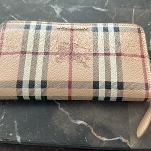 Original Burberry check zip wallet.